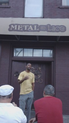 Ajari Eniyi participating in a special post-SXSW outdoor read at Metal and Lace Club. 